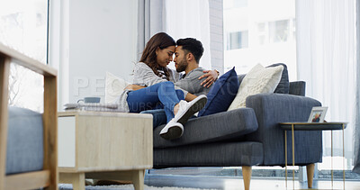 Buy stock photo Forehead, hug and couple with smile, home and chill in living room with woman, embrace or love. Happy, man and bonding with partner in lounge, coffee and comfortable in house, relax or relationship