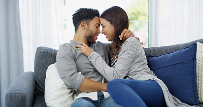 Buy stock photo Forehead, love and bonding with couple on sofa of home for cuddle, support and care. Happy, commitment and trust with man and woman in living room of apartment peace, smile and relationship romance