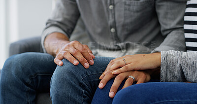 Buy stock photo Couple, holding hands or sofa with empathy for love, care or commitment together at home. Closeup, man and woman with sympathy for bonding, cherish or support in comfort on living room couch at house