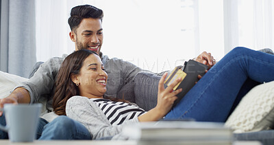 Buy stock photo Online shopping, credit card and couple on sofa, tablet and relax with transactions, savings and payment. House, man and woman with fintech, banking or ecommerce with mortgage, investment or rent