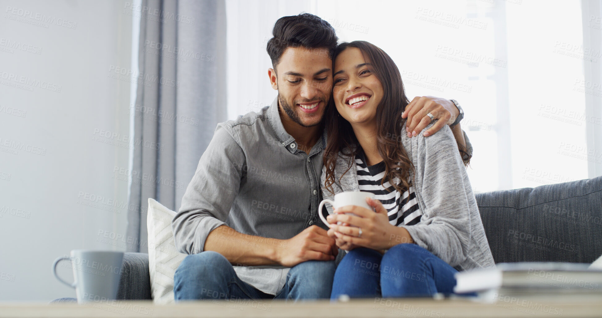 Buy stock photo Happy, relax and couple with coffee on sofa for conversation, bonding and relationship in home. Morning, dating and man hug woman with drink for love, affection and embrace for support in living room