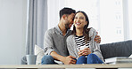 Home, hug and couple with coffee on sofa for conversation, bonding and relax together. Happy, dating and man with woman with drink for relationship, affection and embrace for love in living room