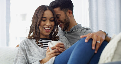 Buy stock photo Laughing, smile and couple with coffee, home and chilling in living room with woman, embrace or love. Happy, man and romance with partner in lounge, tea and comfortable in house, joke or relationship