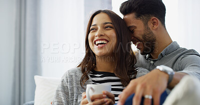 Buy stock photo Bonding, laughing and couple with coffee, home and chilling in living room with woman, hug and love. Happy, man and romance with partner in lounge, tea and comfortable in house, relax or relationship