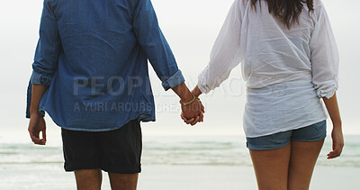 Buy stock photo Back, holding hands and trust with couple on beach for date, summer vacation and support. Happiness, adventure and travel holiday with man and woman outdoors for romantic trip, bonding and relax