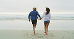 Couple, beach and running on sand or holding hands on honeymoon, holiday or bonding outdoor. Excited woman, man and relationship by sea for fun memory, playful date and back with love and sunset