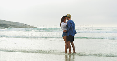 Buy stock photo Couple, beach and embrace with love on vacation for honeymoon, holiday or outdoor bonding. Happy woman, man and relationship by sea for space, romantic date and relax with security in commitment 