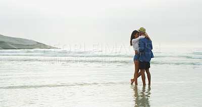 Buy stock photo Couple, beach and hug with love on honeymoon, holiday or bonding outdoor in nature. Happy woman, man and relationship by sea for soulmate, romantic date and mockup space with security in commitment 
