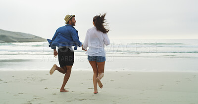 Buy stock photo Couple, beach and running on fun vacation for honeymoon, holiday or bonding outdoor. Happy woman, man and adventure by sea for memory, playful date and space with love, joy and freedom in nature