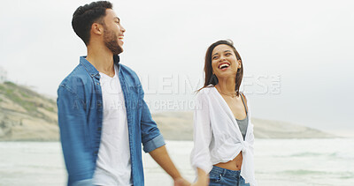 Buy stock photo Holding hands, happy couple and walking on beach for honeymoon, holiday or bonding outdoor. Woman, man and relationship by sea for memory, romantic date and laugh with love and fun stroll in nature