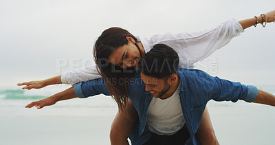 Buy stock photo Couple, flying and smile on beach for freedom, energy and bonding fun together with connection and anniversary travel. Playful, happiness and people piggyback on vacation with love and care outdoor