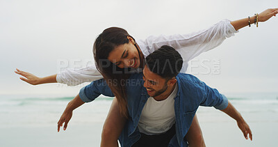 Buy stock photo Beach vacation, couple and piggyback fun on honeymoon, holiday or bonding outdoor. Happy woman, man and relationship by sea for playful memory, romantic date and love with freedom, support and care