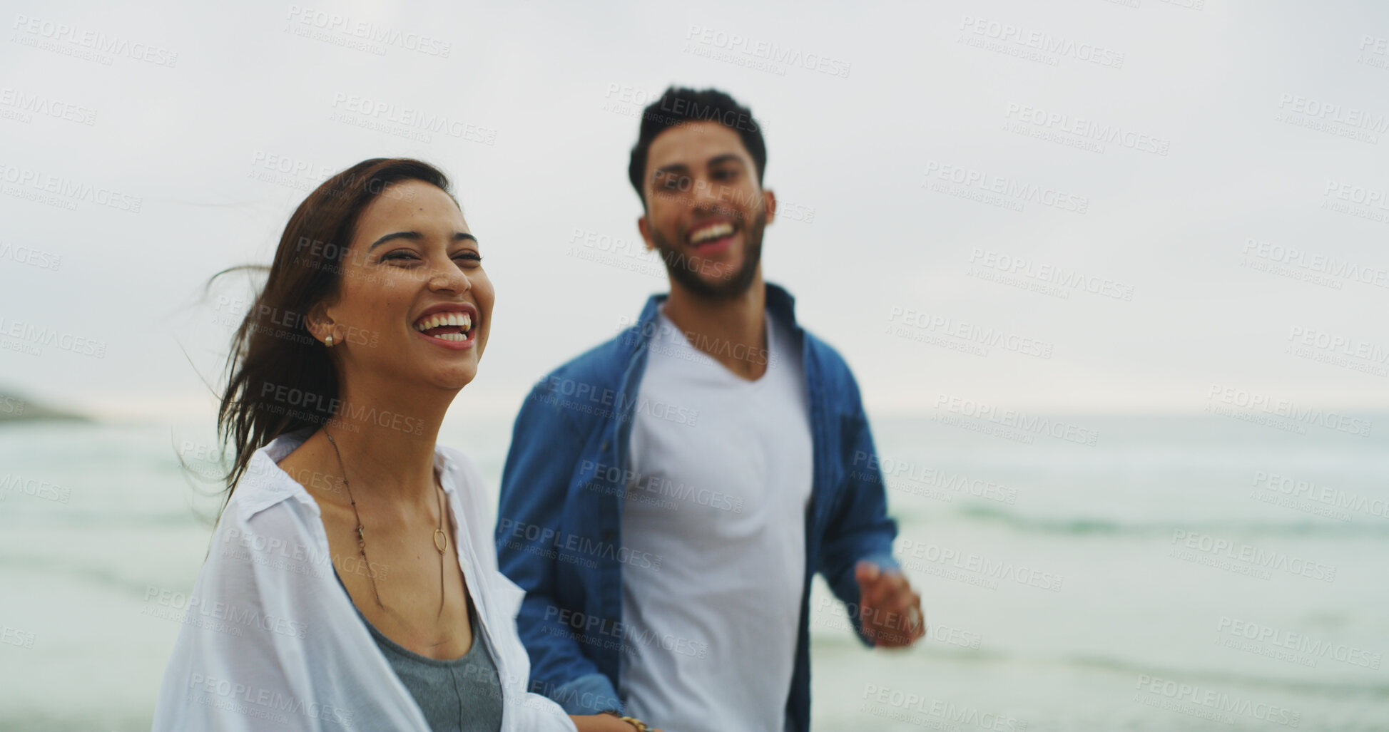 Buy stock photo Beach, couple and laughing with joke on vacation, holiday and bonding together on honeymoon. Ocean, man and woman in relationship for love embrace, walking and travel adventure in Florida by space