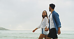 Walking, holding hands and travel with couple on beach for space, summer vacation and smile. Happiness, adventure and holiday with man and woman outdoors for romantic trip, bonding and trust