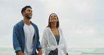Walking, travel and love with couple on beach for space, summer vacation and smile. Happiness, adventure and holiday with man and woman outdoors for romantic trip, bonding and trust together
