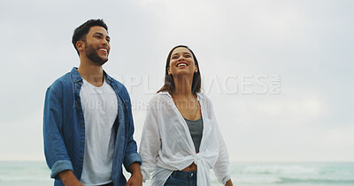 Buy stock photo Happy couple, beach and walking together on honeymoon, holiday or bonding. Woman, man and relationship in nature outdoor for memory, romantic date and holding hands with love on stroll by sky space