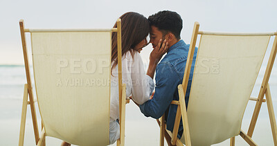 Buy stock photo Love, beach chair or couple on vacation for honeymoon, holiday or bonding outdoor. Woman, man or relationship care by sea for romantic date, kiss and back with forehead touch for connection in nature