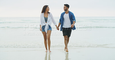 Buy stock photo Happy couple, love and walking on beach holding hands on honeymoon, holiday or bonding outdoor. Woman, man and relationship by sea for memory, romantic date and trust on tropical stroll by space