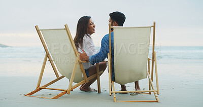 Buy stock photo Love, beach chair and couple laughing on vacation for honeymoon, holiday or bonding outdoor. Woman, man and relationship by sea for romantic date, funny joke and care with connection in nature