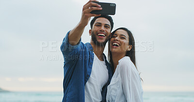 Buy stock photo Happy couple, beach and selfie with love on honeymoon, holiday or bonding outdoor. Woman, man and together by sea for memory, romantic date and space with laugh on social media for profile picture