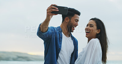 Buy stock photo Couple, beach and laugh for selfie with love on honeymoon, holiday or bonding outdoor. Woman, man and together by sea for memory, romantic date and space with joke on social media for profile picture