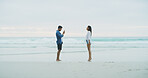 Beach, couple and photograph of woman on vacation, holiday or bonding outdoor. Happy people, honeymoon and love by sea for memory, date and space with connection for social media profile picture
