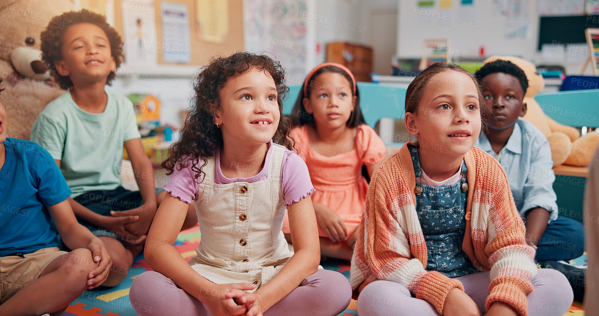 Buy stock photo School, classroom and children listening on floor for reading lesson, education and learning. Teaching, students and happy group of kids with teacher for storytelling, development and knowledge
