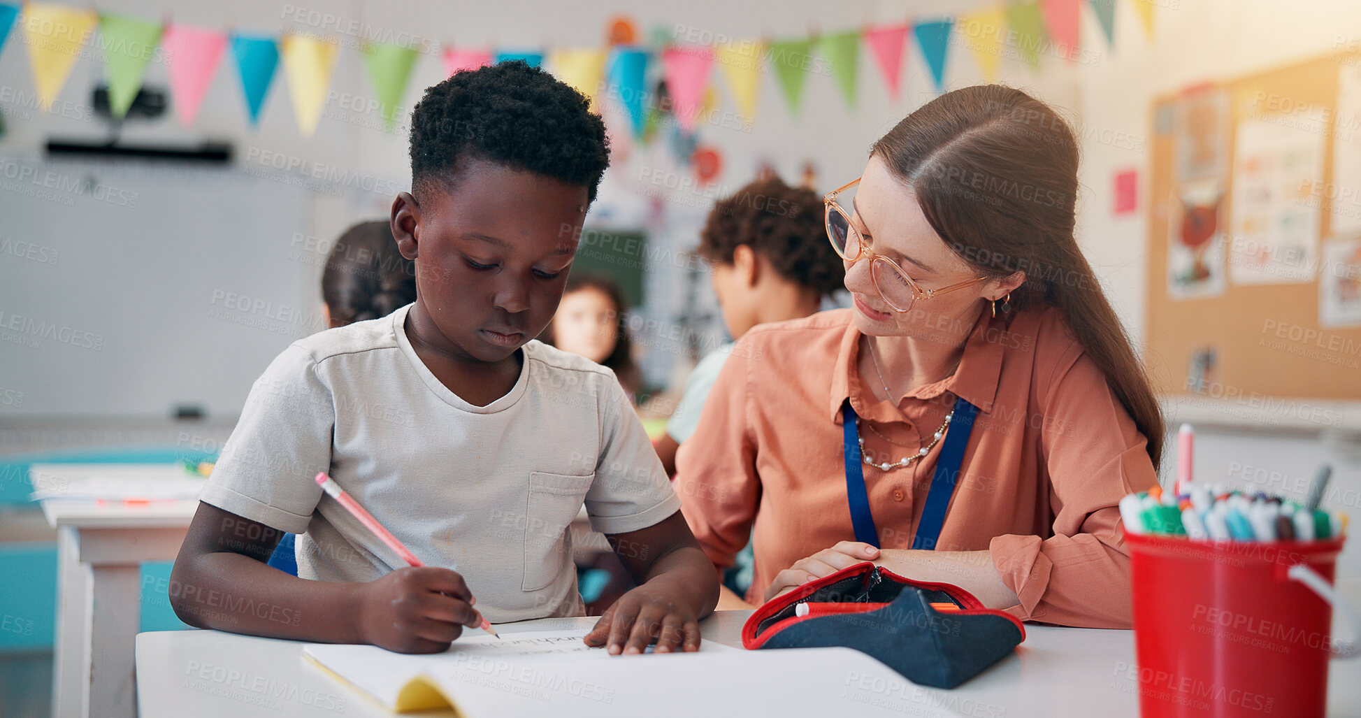 Buy stock photo Education, boy or teacher in classroom, help or advice with literacy knowledge. Child development, woman or students in school, assisted learning or conversation with assessment, questions or support