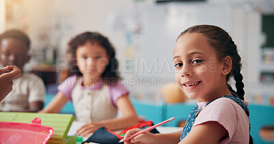 Buy stock photo Portrait, education and writing with girl in classroom for child development, future and learning. Academy, growth and scholarship with kid and students in school for knowledge, lesson and study