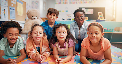Buy stock photo Children, group and portrait on floor in classroom, funny face and playful with diversity, education and game. School kids, happy and comic joke with friends, silly and smile for learning at academy