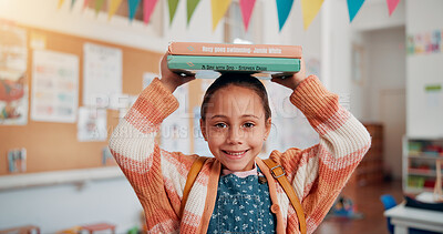 Buy stock photo Girl, smile and books on head in classroom, portrait and excited for education, story or development. Child, happy and learning at academy, study and scholarship with reading at school in Mexico