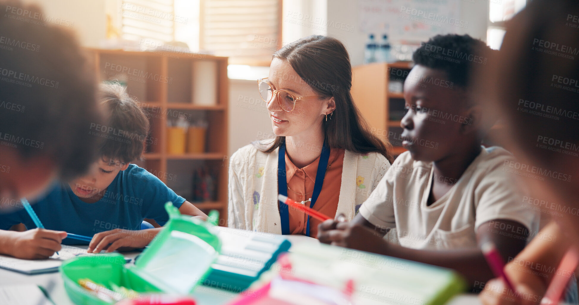 Buy stock photo Education, learning or writing with students and teacher in classroom of school for child development. Growth, knowledge or teaching with learner kids and woman in lesson for academics or course