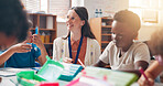 Writing, learning and teacher helping children in classroom for language development, education or growth. Notebook, advice and woman educator with kid students for lesson at elementary school.