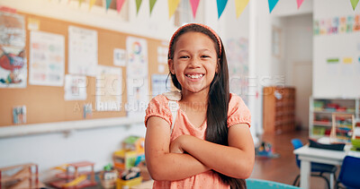 Buy stock photo Arms crossed, student and education with girl in classroom for learning, future and youth. Scholarship, academy and growth with portrait of kid in school for child development, knowledge and lesson