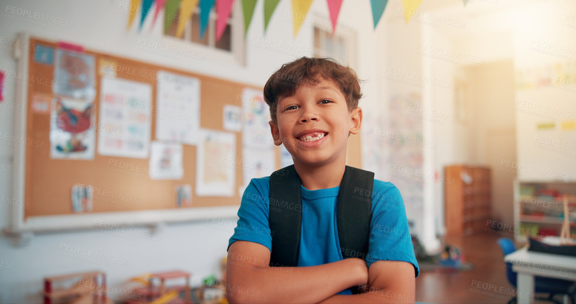 Buy stock photo Arms crossed, student and education with boy in classroom for learning, future and youth. Scholarship, academy and growth with portrait of kid in school for child development, knowledge and lesson