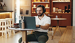 Headphones, laptop and happy man in cafe for remote work, music and copywriter research for blog. Coffee shop, freelancer and listen to audio on computer for writing, typing article or online project