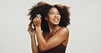 Comb, hair and portrait of woman in studio for volume, natural texture and beauty. Happiness, self care and cosmetics with African person on white background for growth, shampoo and salon treatment