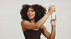 Spray, hair and portrait of woman in studio for volume, natural texture and beauty. Hydration, self care and cosmetics with African person on white background for growth, shine and salon treatment
