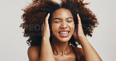 Buy stock photo Excited, afro or African woman with hair care, texture or glow for health, volume or natural shampoo. Studio, face or model with beauty, smile or growth with confidence or results by white background