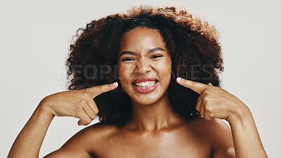 Buy stock photo African woman, skincare and point at face, happy or excited for transformation with results by studio background. Girl, person and portrait for cosmetics, dermatology and glow with beauty in Kenya
