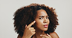 Portrait, woman and skincare for acne, checking and skin breakout on white studio background. Grooming, African model and person with cosmetics, blemish and spa treatment for natural beauty aesthetic