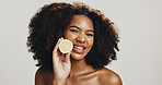 Lemon, skincare and portrait of woman in studio for wellness, organic detox and natural beauty. Dermatology, spa and African person with fruit for vitamin C, benefits or cosmetics on white background