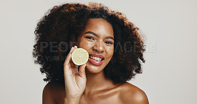 Buy stock photo Lemon, skincare and portrait of woman in studio for wellness, organic detox or natural beauty. Dermatology, space and African person with fruit for vitamin C, benefit or cosmetics on white background
