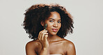 Portrait, skincare and woman with jade roller in studio for glowing skin, lymphatic drainage and detox circulation. African person, cosmetics tool and massage face for dermatology on white background