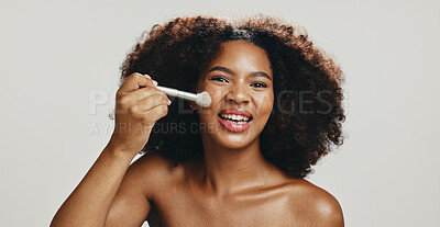 Buy stock photo Portrait, cosmetics and woman with brush, makeup or model with tools for beauty, studio or confident. White background, glow and application of foundation with space, African person or dermatology