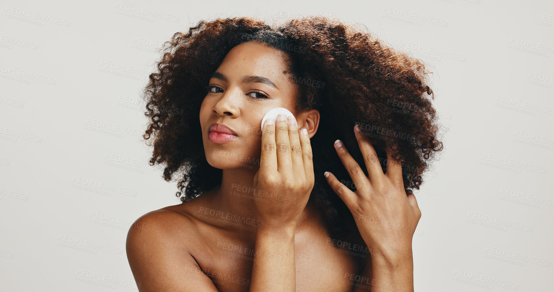 Buy stock photo Cotton, skincare and beauty with portrait of woman in studio for spa treatment, self care and cosmetic. Aesthetic, toner pad and dermatology with African person on white background for shine and glow