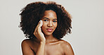 Cotton, studio or African woman with skincare, portrait or hygiene for treatment or cleaning face. Girl, white background or model with confidence, cosmetics or facial beauty with makeup removal pad