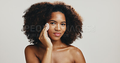 Buy stock photo Cotton, studio or African woman with skincare, portrait or hygiene for treatment or cleaning face. Girl, white background or model with confidence, cosmetics or facial beauty with makeup removal pad