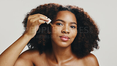 Buy stock photo Serum, skincare and beauty with portrait of woman in studio for spa treatment, self care and cosmetic. Aesthetic, oil and dermatology with African person on white background for shine, glow and salon