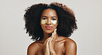 Eye patches, skincare and portrait of woman in studio for wellness, anti aging or facial treatment. Dermatology, spa and African person with pads for collagen, beauty or cosmetics on white background
